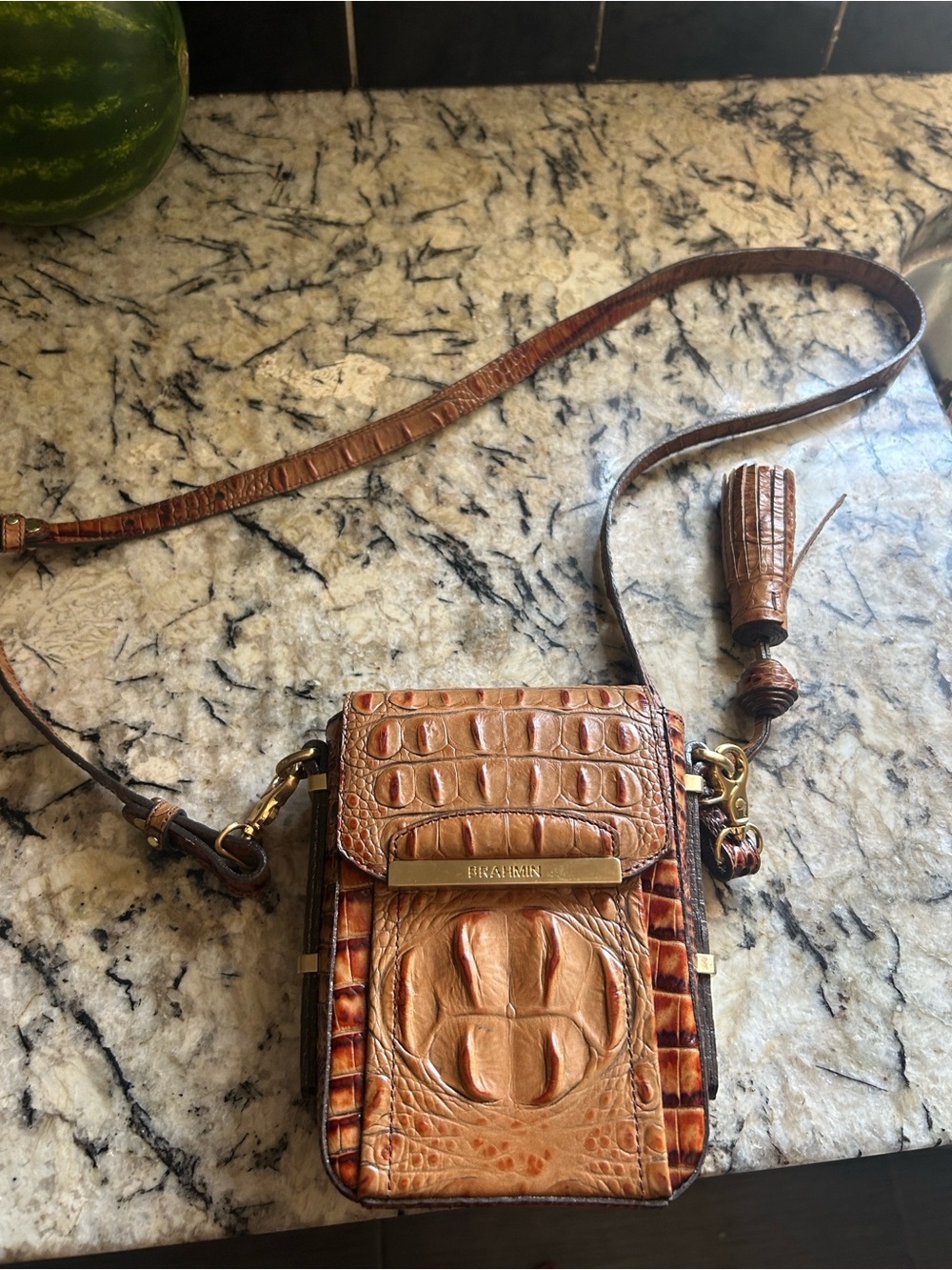 Brahmin croc-embossed crossbody with the distinctive gold BRAHMIN bar across the